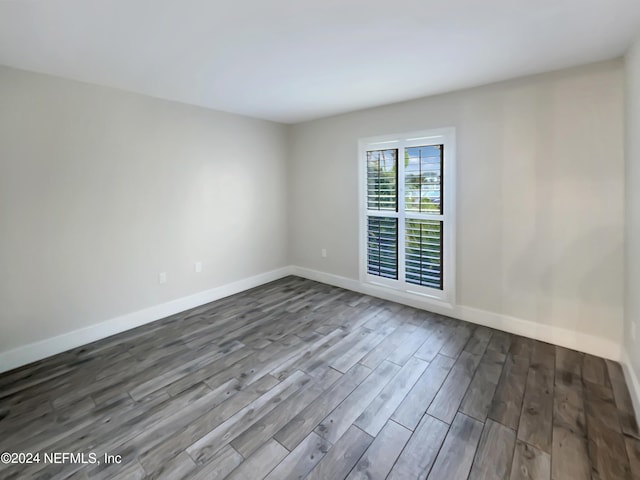 empty room with wood-type flooring