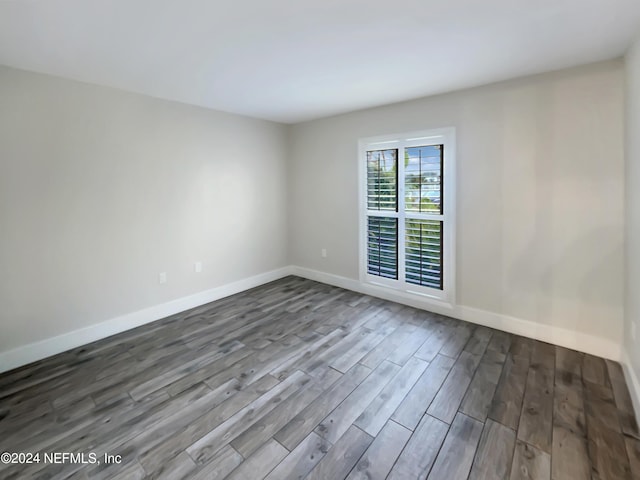 6300 A1A S Unit A74D, Saint Augustine, FL 32080 - spare room featuring dark wood-style flooring and baseboards