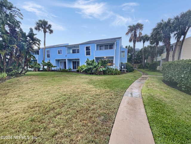 6300 A1A S Unit A74D, Saint Augustine, FL 32080 - view of front of home featuring a front yard