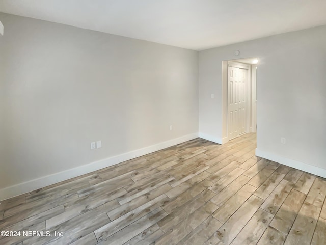 unfurnished room featuring light hardwood / wood-style floors