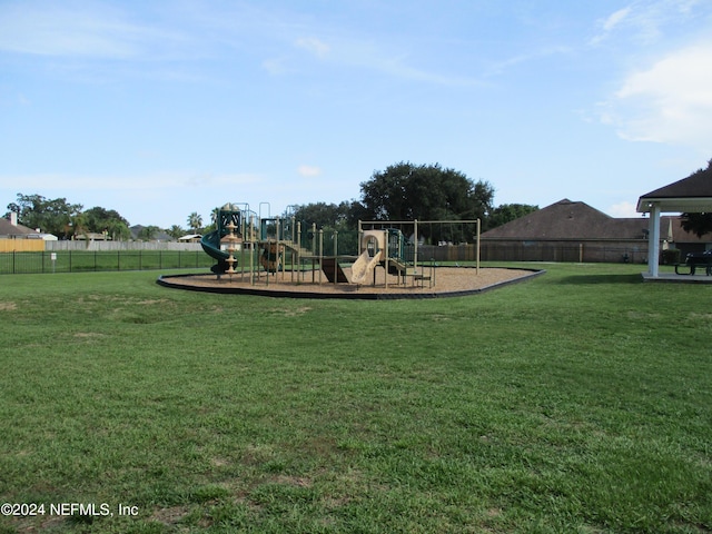 view of playground with a yard