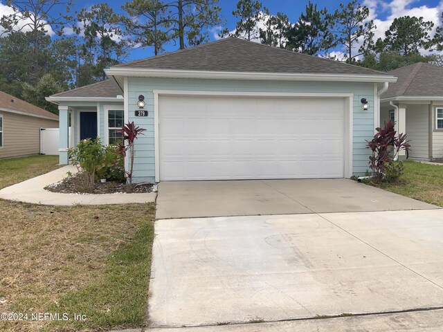 single story home featuring a garage