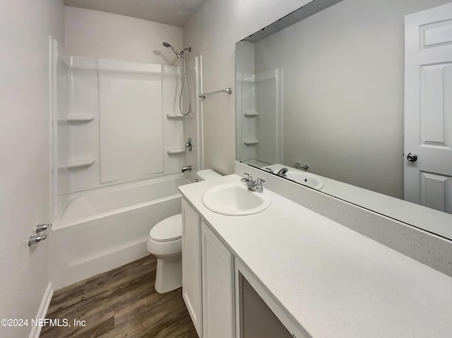 full bathroom with toilet, hardwood / wood-style flooring, shower / bath combination, and vanity