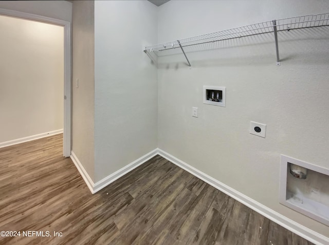 washroom featuring dark hardwood / wood-style flooring, washer hookup, and electric dryer hookup