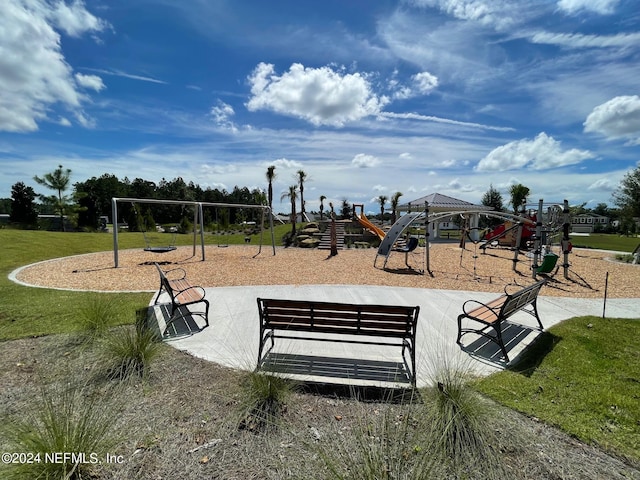 view of jungle gym with a lawn