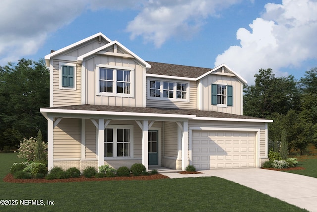 view of front of home with a front yard and a garage