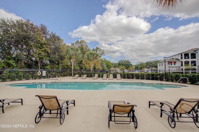 view of swimming pool with a patio area