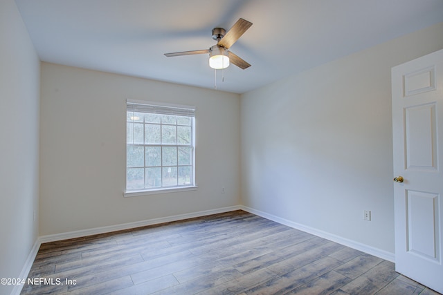 spare room featuring ceiling fan and light wood-type flooring