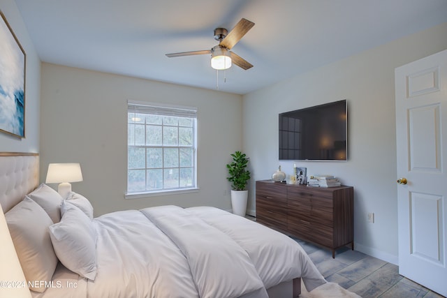 bedroom featuring light hardwood / wood-style floors and ceiling fan