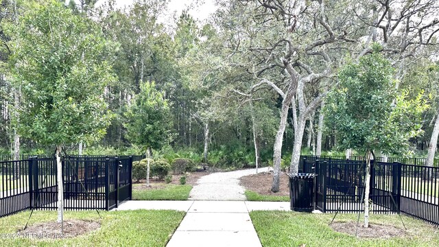 view of property's community with a lawn