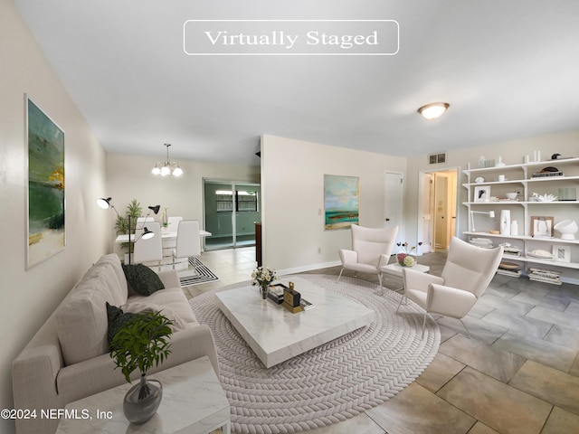 living room with a notable chandelier