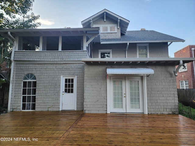 back of property featuring french doors and a deck