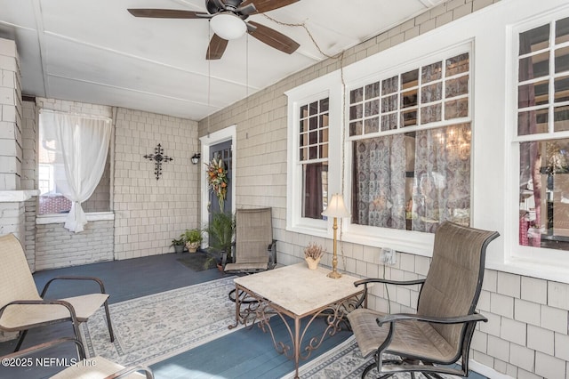 view of patio featuring ceiling fan