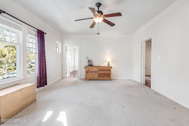 unfurnished bedroom with ensuite bath, ceiling fan, light carpet, and ornamental molding