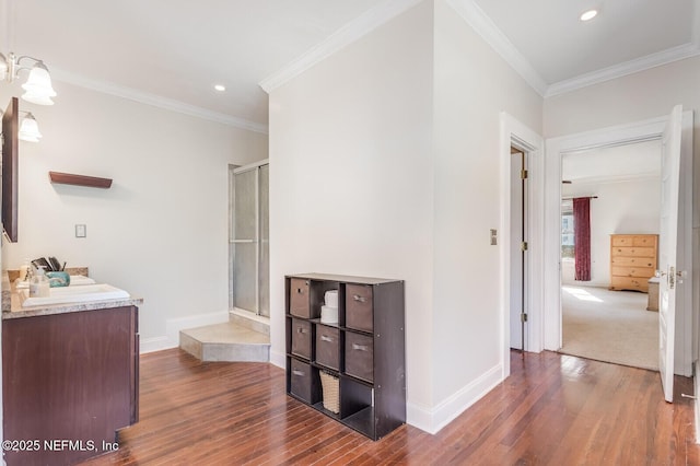 bathroom featuring hardwood / wood-style floors and ornamental molding