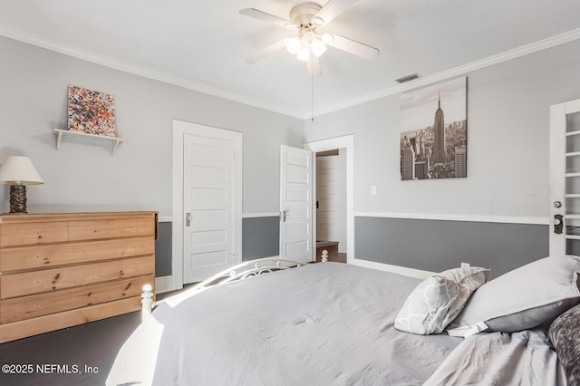 bedroom featuring ceiling fan and crown molding