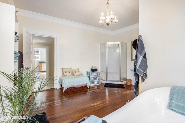 bedroom with hardwood / wood-style flooring, crown molding, and an inviting chandelier