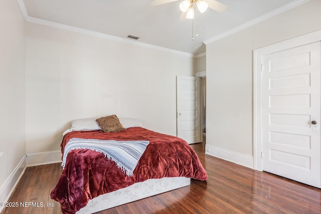 bedroom with ceiling fan, ornamental molding, and dark hardwood / wood-style floors