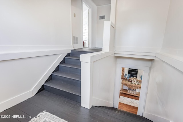 stairway featuring hardwood / wood-style floors