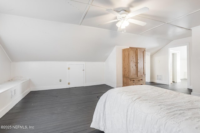 bedroom with ceiling fan, dark hardwood / wood-style floors, and lofted ceiling