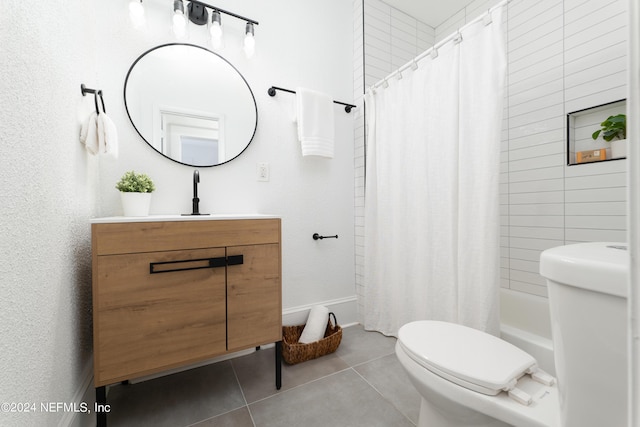 full bathroom with toilet, tile patterned flooring, and vanity