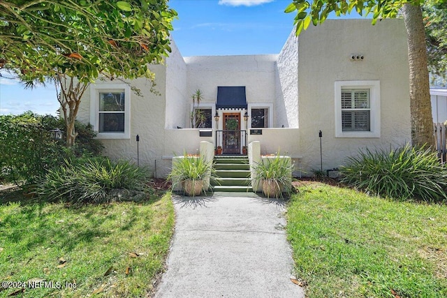 view of front of home with a front yard