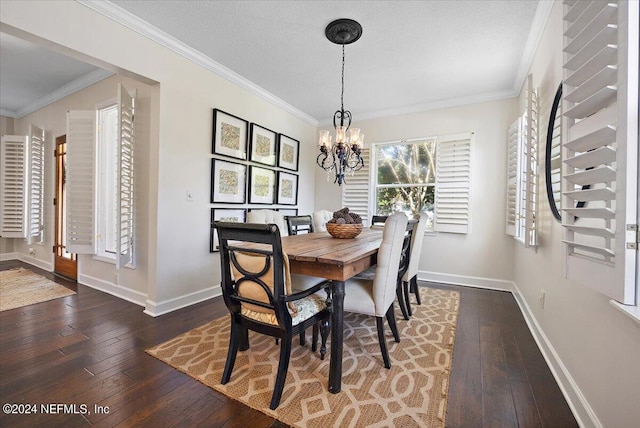 dining space featuring crown molding, dark wood-type flooring, a textured ceiling, and a notable chandelier