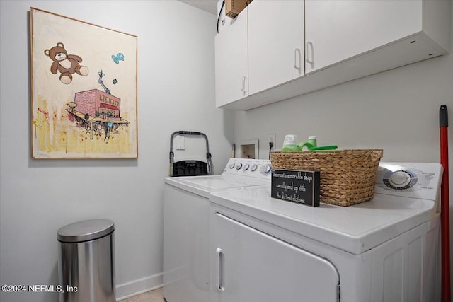 washroom with cabinets and independent washer and dryer