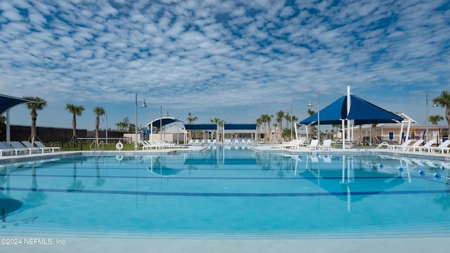 view of swimming pool featuring a water view