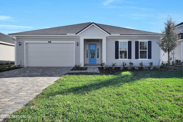 ranch-style home with a garage and a front lawn