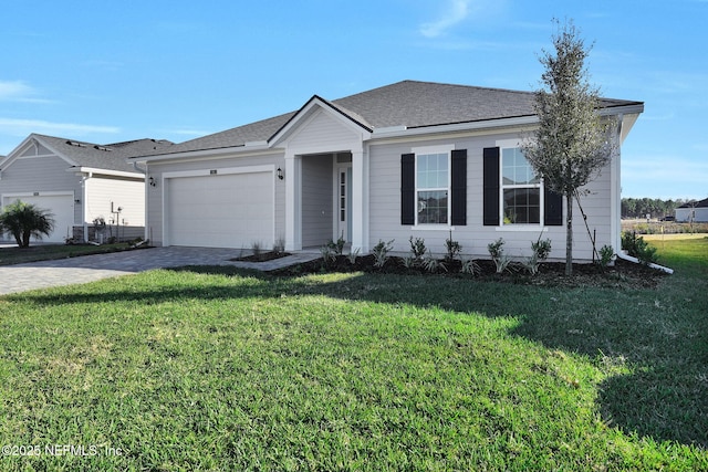 ranch-style home featuring a front lawn and a garage