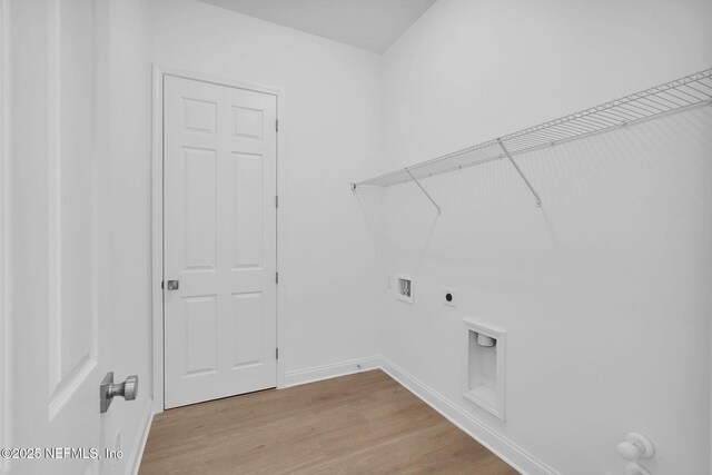 laundry room featuring hookup for a washing machine, hookup for a gas dryer, hookup for an electric dryer, and light wood-type flooring