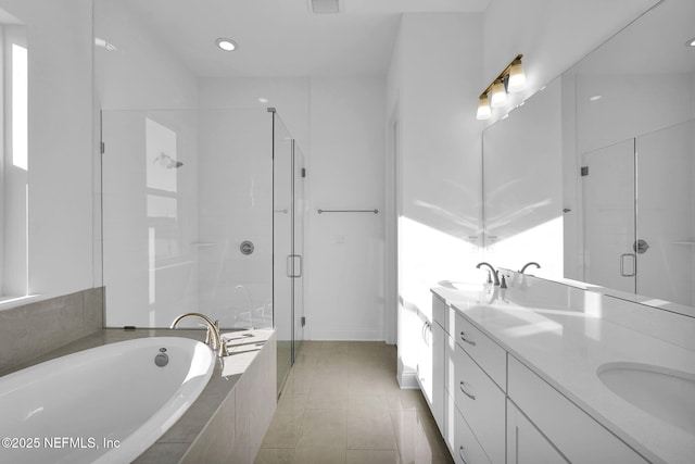 bathroom with vanity, tile patterned flooring, and independent shower and bath