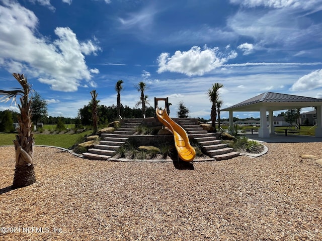 surrounding community with a playground and a gazebo