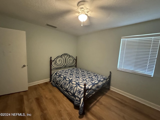 bedroom featuring hardwood / wood-style floors and ceiling fan