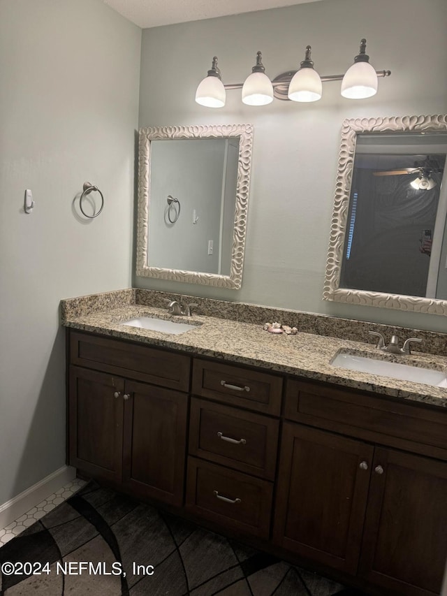 bathroom with vanity and tile patterned floors