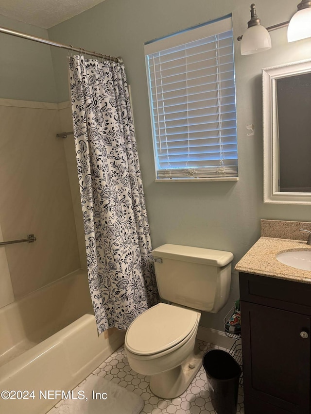 full bathroom featuring tile patterned flooring, vanity, shower / bath combination with curtain, and toilet