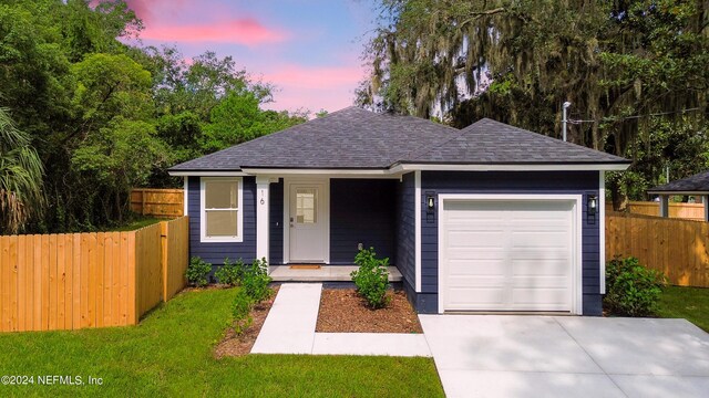 ranch-style home featuring a garage