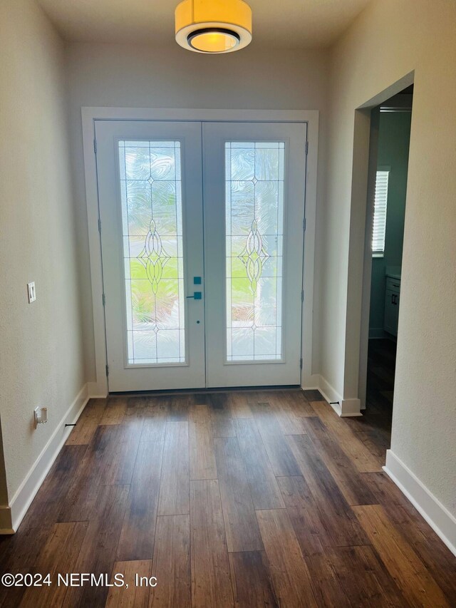 doorway featuring dark hardwood / wood-style flooring and french doors