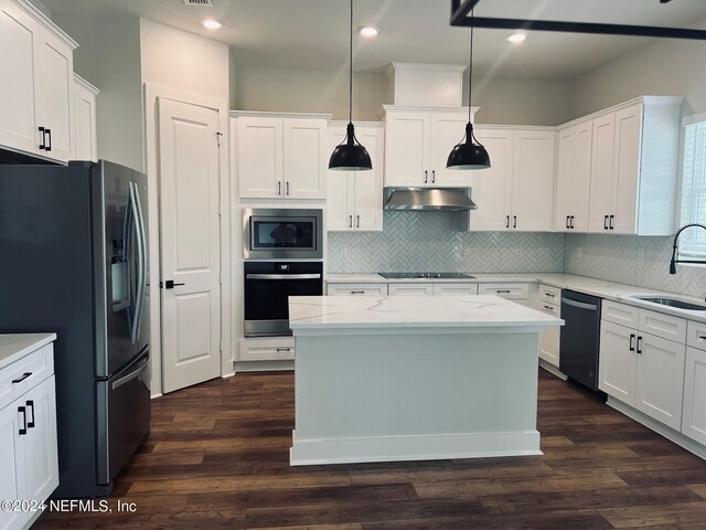 kitchen featuring sink, decorative light fixtures, light stone counters, white cabinetry, and stainless steel appliances