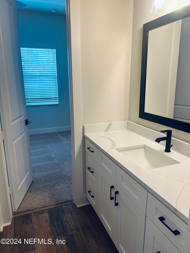 bathroom featuring hardwood / wood-style floors and vanity