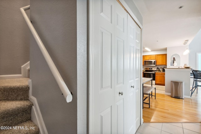 stairs featuring tile patterned flooring