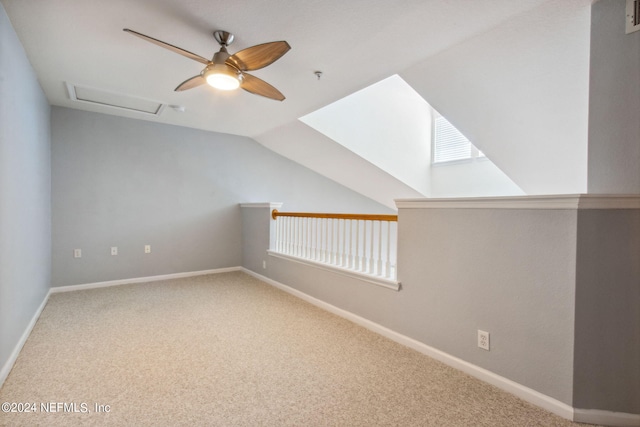 bonus room featuring a wealth of natural light, carpet floors, ceiling fan, and lofted ceiling