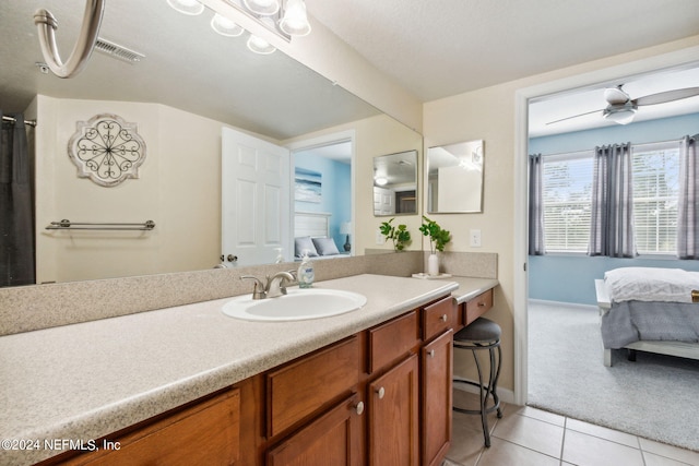 bathroom with tile patterned floors, ceiling fan, and vanity