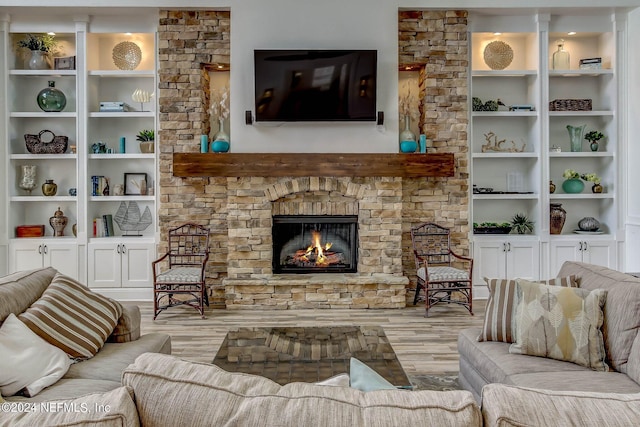 living room featuring light hardwood / wood-style floors and a fireplace