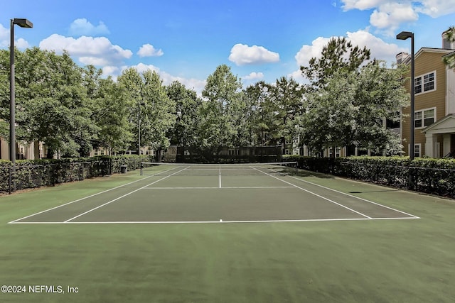 view of sport court with basketball hoop