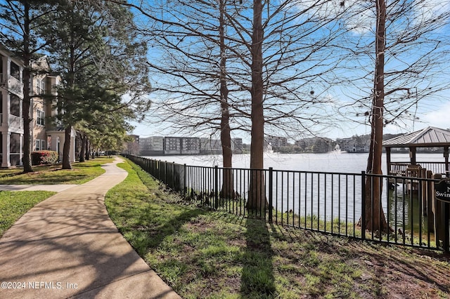 view of yard featuring a gazebo and a water view