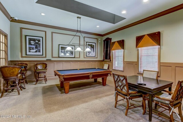 recreation room with crown molding, pool table, and light carpet