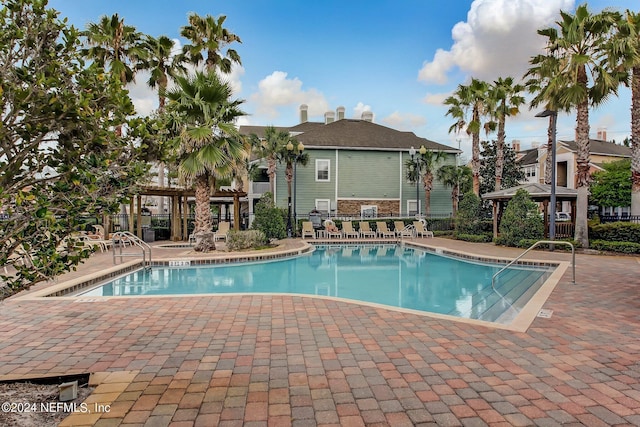 view of swimming pool featuring a gazebo and a patio
