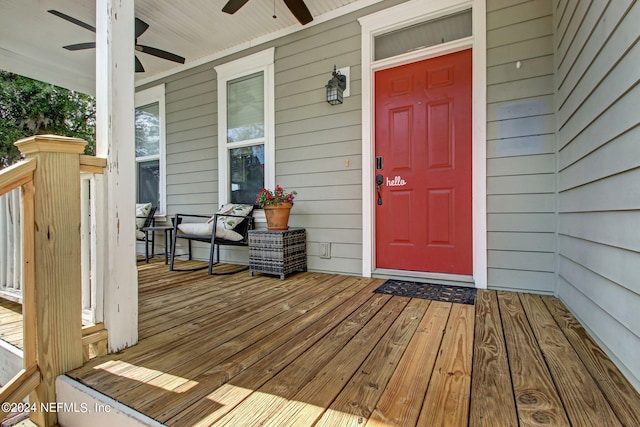 doorway to property featuring ceiling fan and covered porch